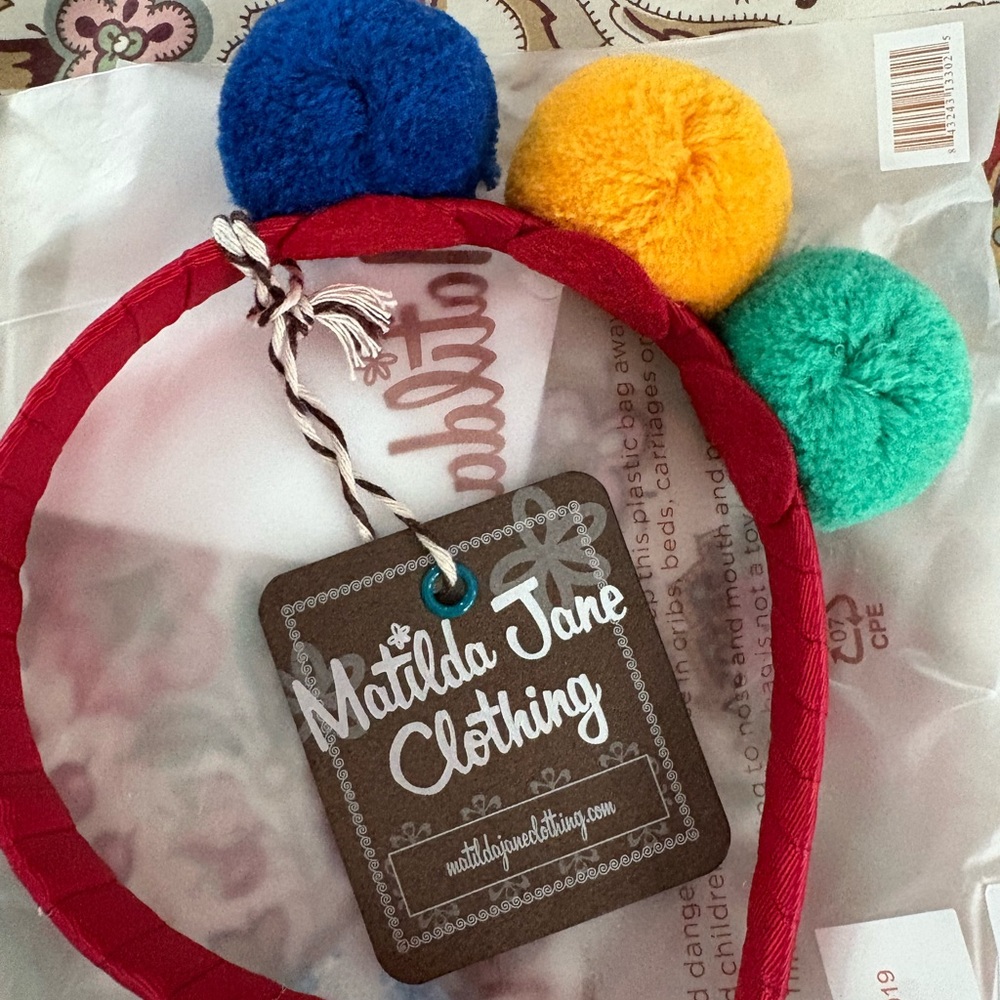 Matilda Jane Red Headband with Blue, Yellow, and Green Pom Poms NWT